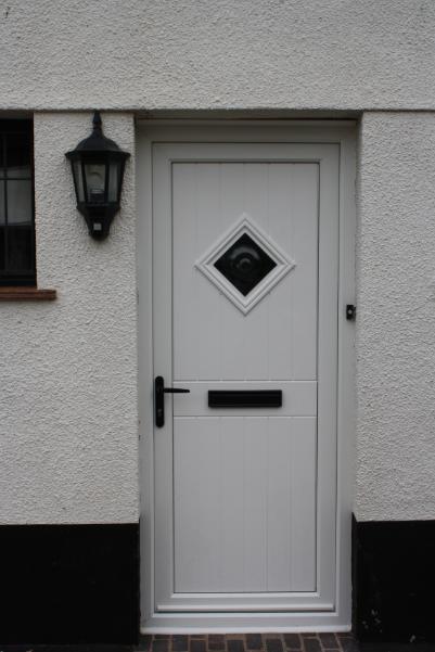 Cottage Bullion Door available as a Flood Door or Security Door in White, Wood Grain or a range of Door Colour Options.